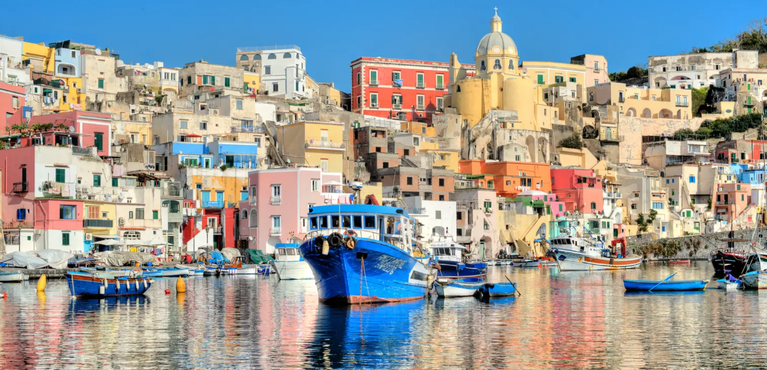 Colorful houses and fishing boats in Marina Corricella, Procida